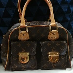 Louis Vuitton Manhattan handbag with buckle pockets